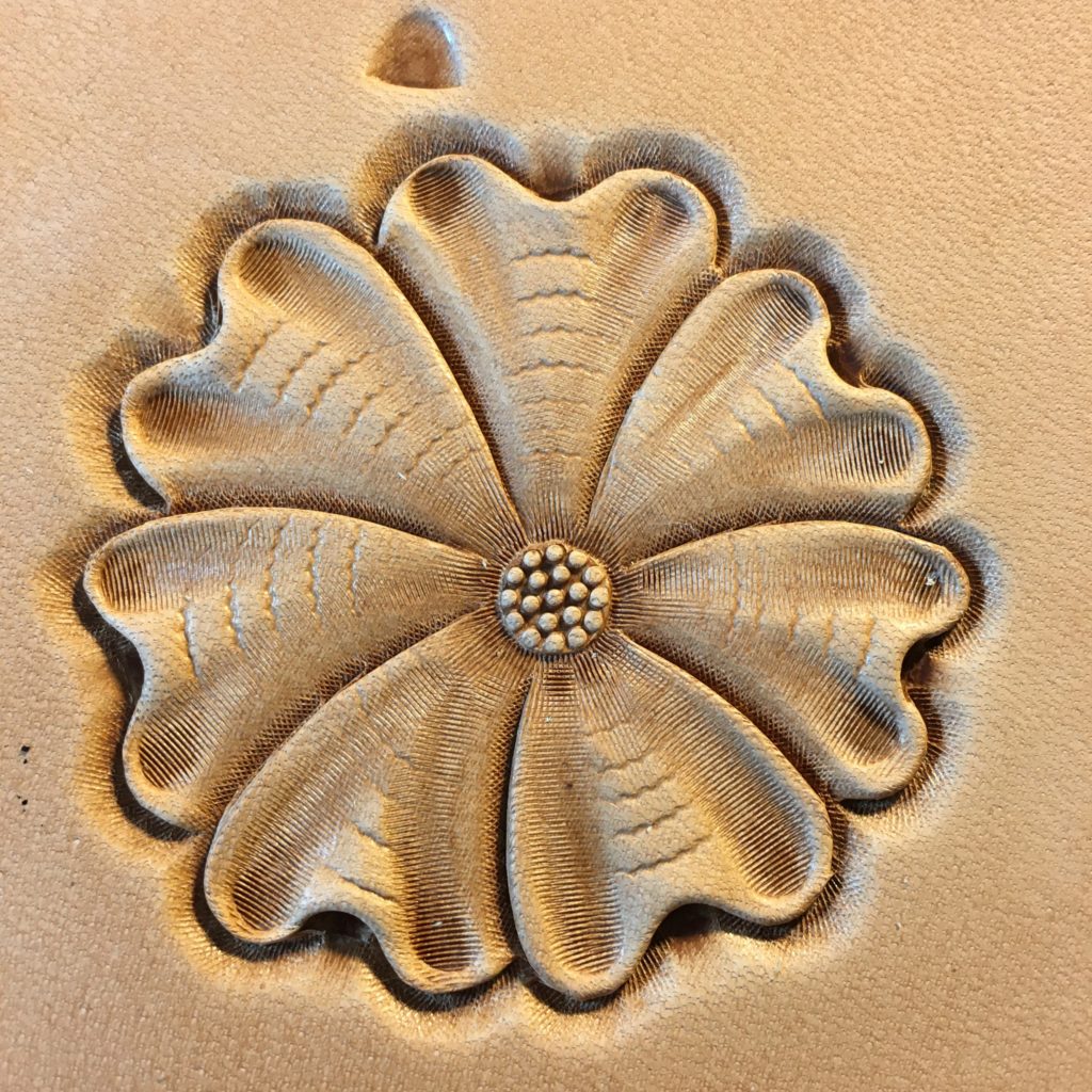 Flower Carving in leather showing all the beveling steps