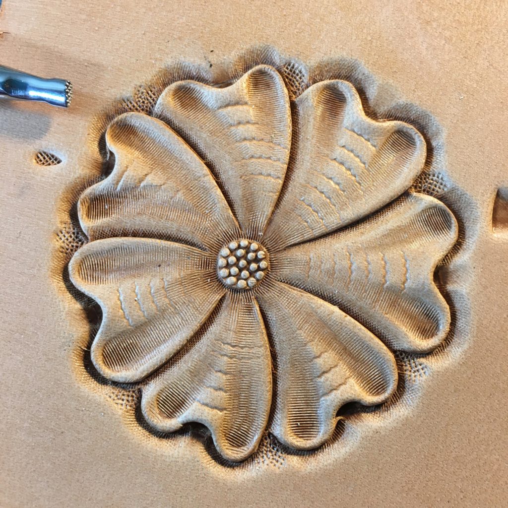 Starting to background around the flower carving