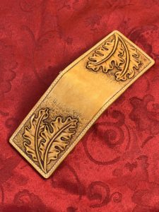 Leather money clip with oak leaf carving 